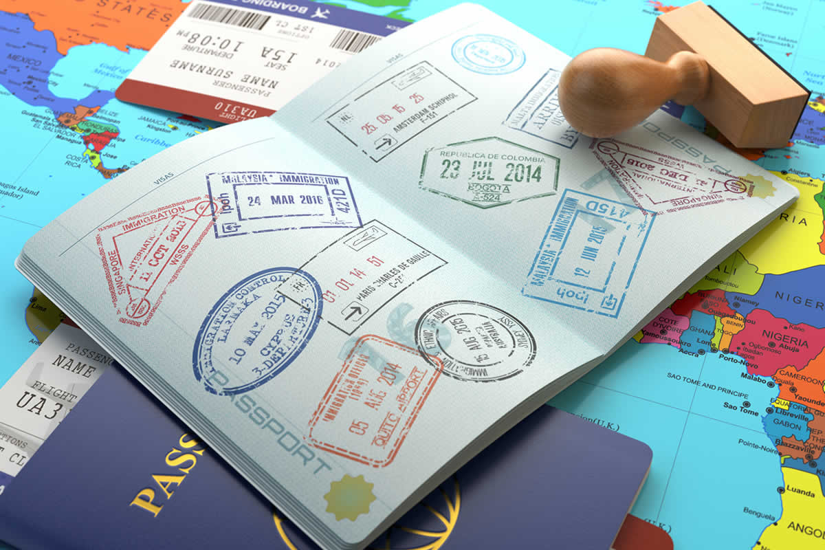 A passport with multiple stamps on it - Digital Nomad vs Self-Employed Visa