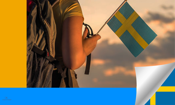 A female holding Swedish flag - Sweden Granted Residence Permits