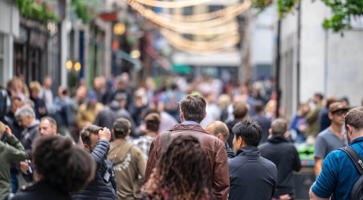 An image showing a rush of people in a street - Switching visas in UK