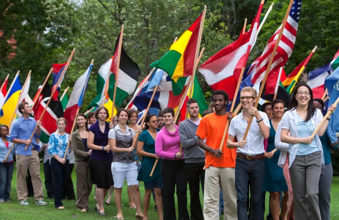 International students at a university campus with their national flags - Study in the United States