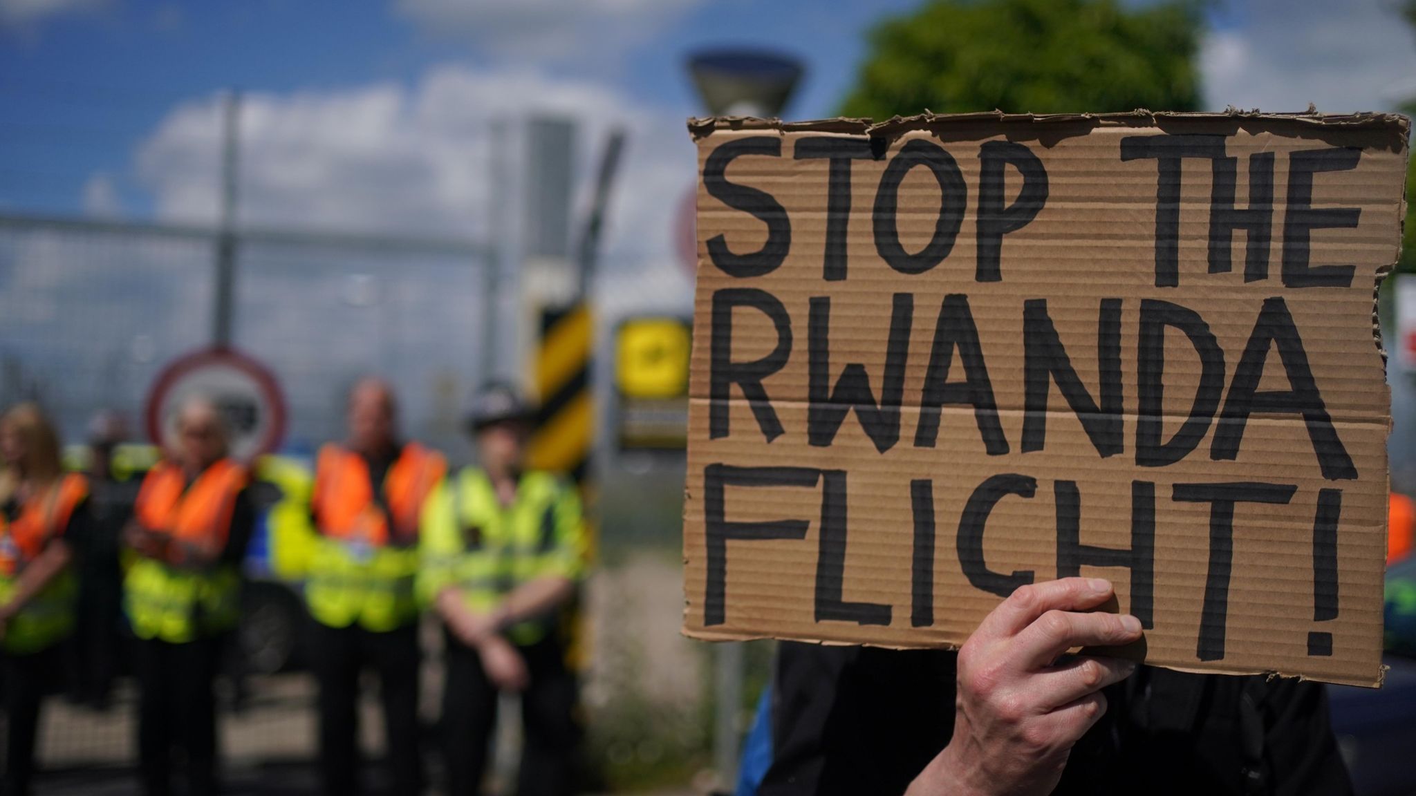 A placard saying "Stop the Rwanda flight" - Deporting of Asylum Seekers to Rwanda